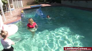 Four girls are in the pool sucking and riding on one lucky cock